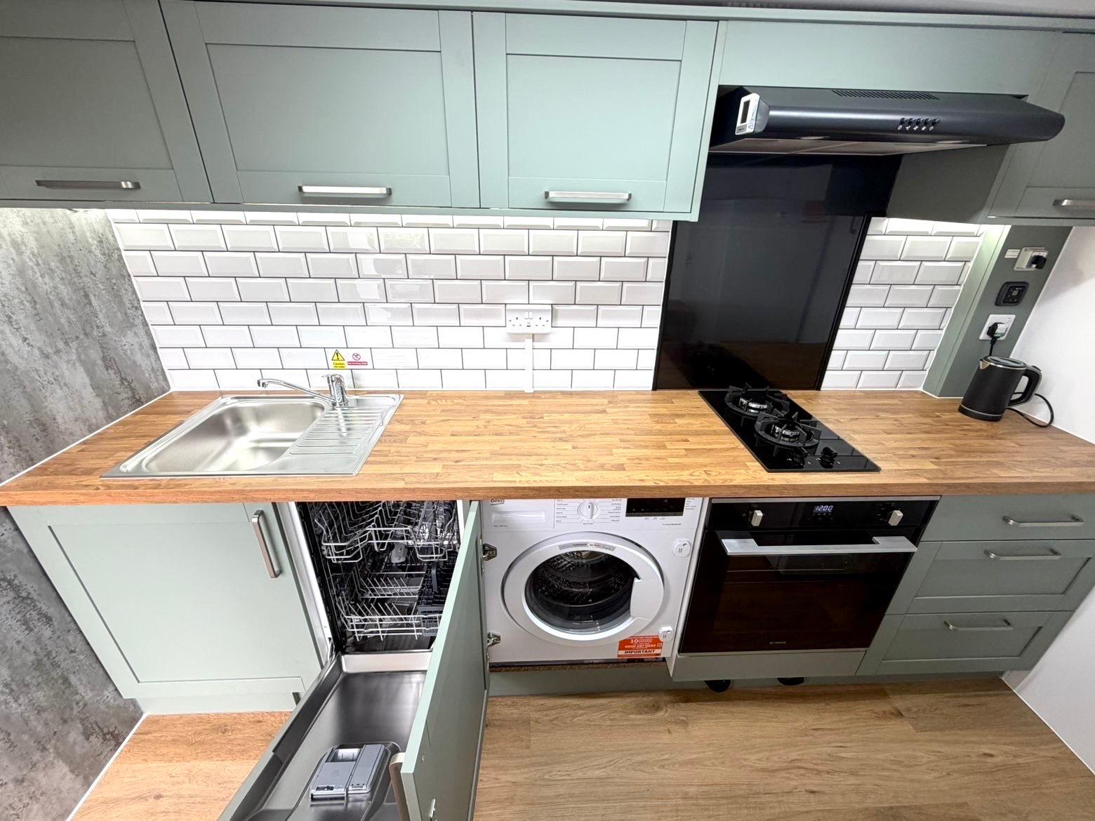 Full interior view showing sink, hob, oven and storage